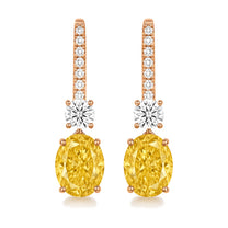 Solange earrings in 14K rose gold with a fancy yellow oval-cut lab-grown diamond