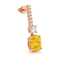 Solange earrings in 14K rose gold with a fancy yellow oval-cut lab-grown diamond