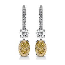 Solange earrings in 14K white gold with a fancy yellow oval-cut lab-grown diamond